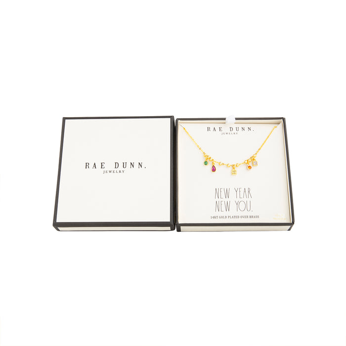 Rae Dunn multi color charms necklace in yellow gold plated brass in a NEW YEARS box