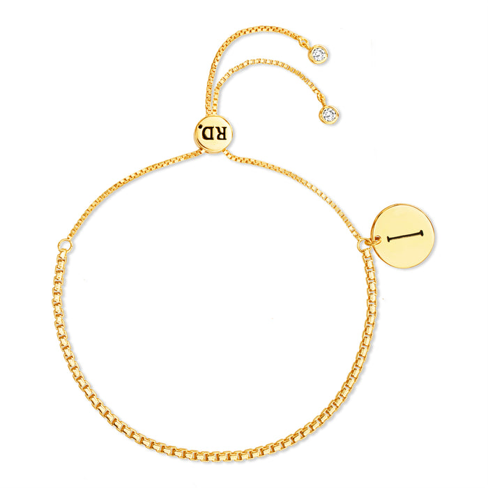 Rae Dunn initial disc bracelet in yellow gold plated brass with