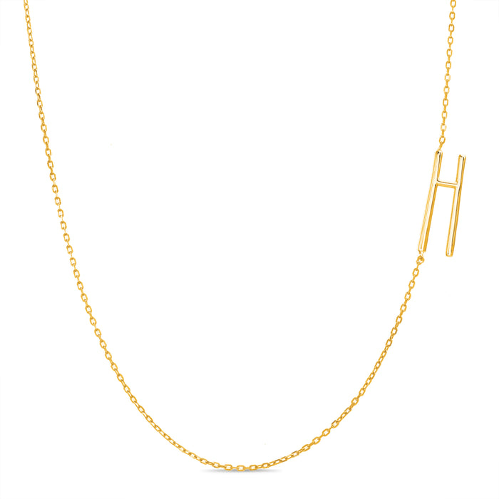 Rae Dunn asymmetrical initial necklace in yellow gold plated brass