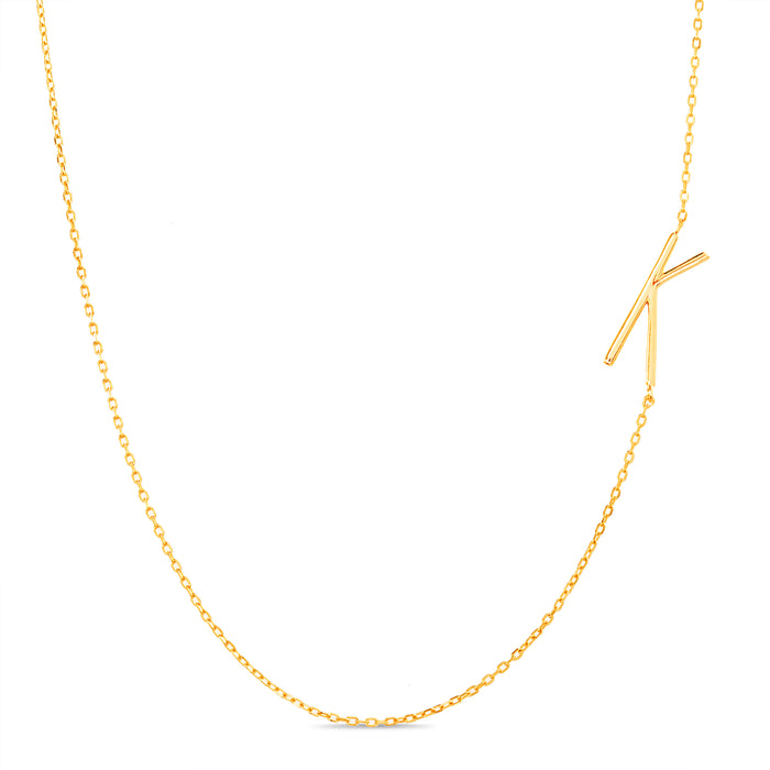 Rae Dunn asymmetrical initial necklace in yellow gold plated brass