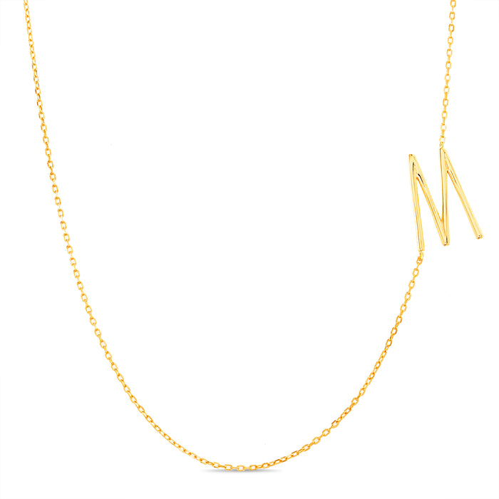 Rae Dunn asymmetrical initial necklace in yellow gold plated brass