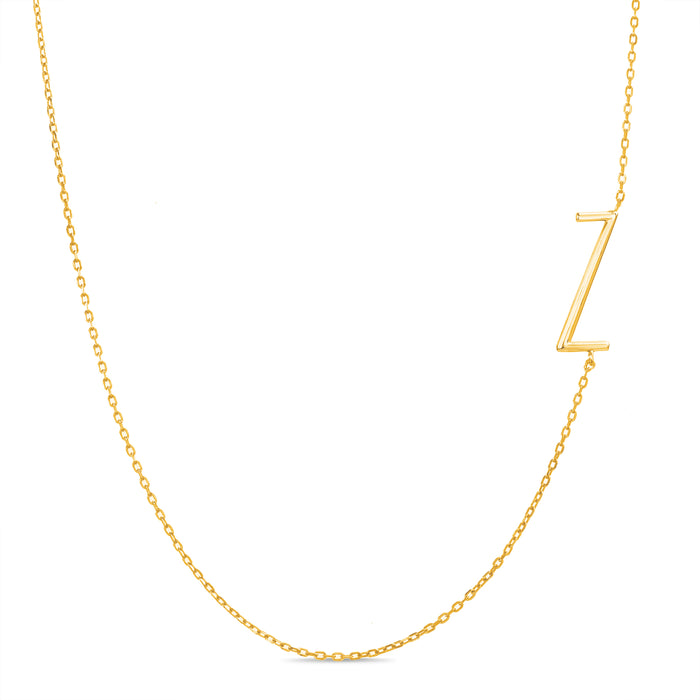 Rae Dunn asymmetrical initial necklace in yellow gold plated brass